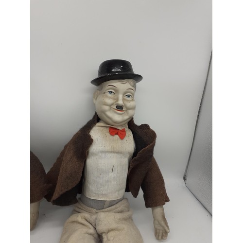 537 - LARGE LAUREL AND HARDY POPPET FIGURES WITH PORCELAIN FACES