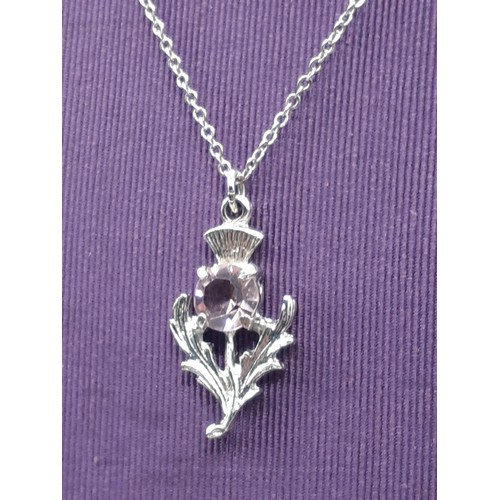 608 - A SCOTTISH PEWTER AND AMETHYST PENDANT AND CHAIN