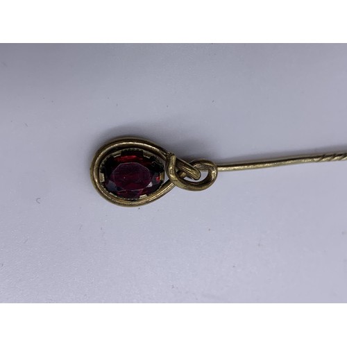 652 - A VICTORIAN AMETHYST STICKPIN