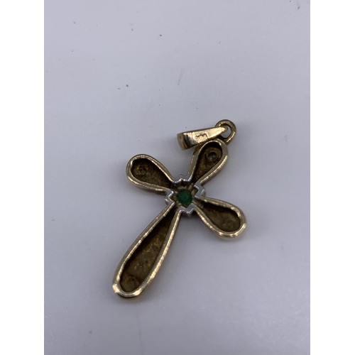 683 - A 9ct GOLD EMERALD AND DIAMOND CROSS/PENDANT 2.3grms