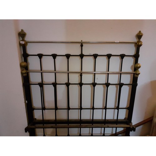 173 - A 4ft CAST AND BRASS BED