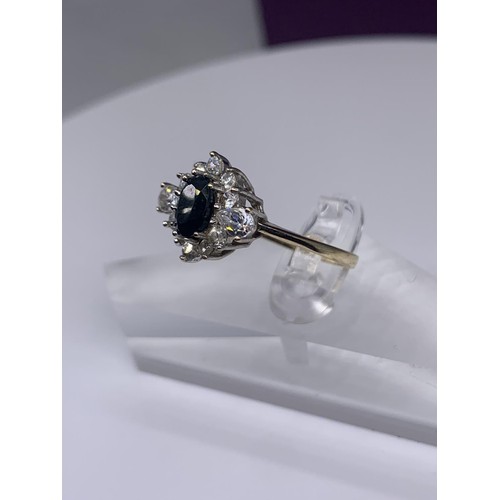 701 - A 9ct GOLD SAPPHIRE AND MULTI STONE RING size o