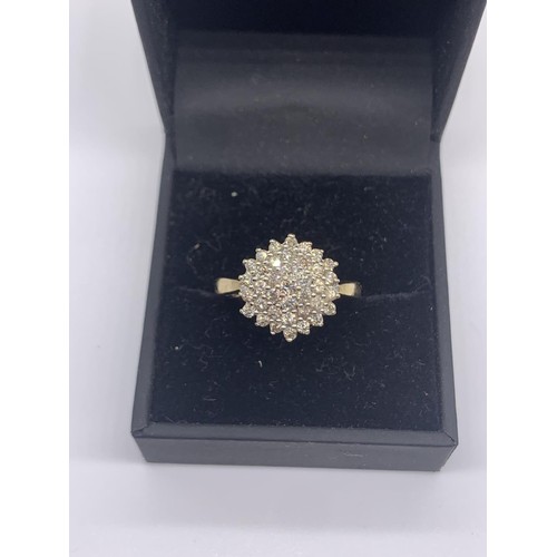 705 - A 9ct GOLD DIAMOND CLUSTER RING