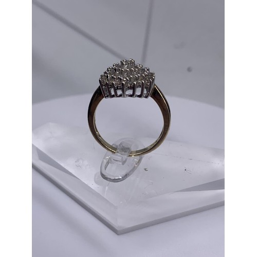 705 - A 9ct GOLD DIAMOND CLUSTER RING