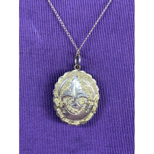 707 - BEAUTIFULLY ORNATE LOCKET ON 9CT CHAIN 8 GRAMS