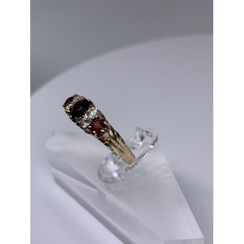 718 - 9ct GOLD RUBY AND WHIT SAPPHIRE RING size o/p