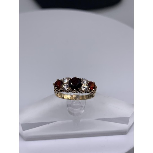 718 - 9ct GOLD RUBY AND WHIT SAPPHIRE RING size o/p