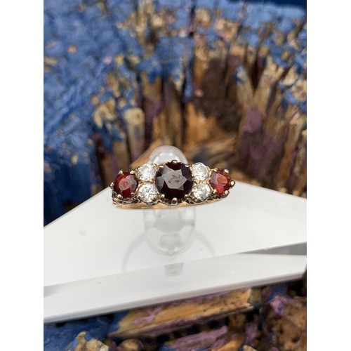 718 - 9ct GOLD RUBY AND WHIT SAPPHIRE RING size o/p