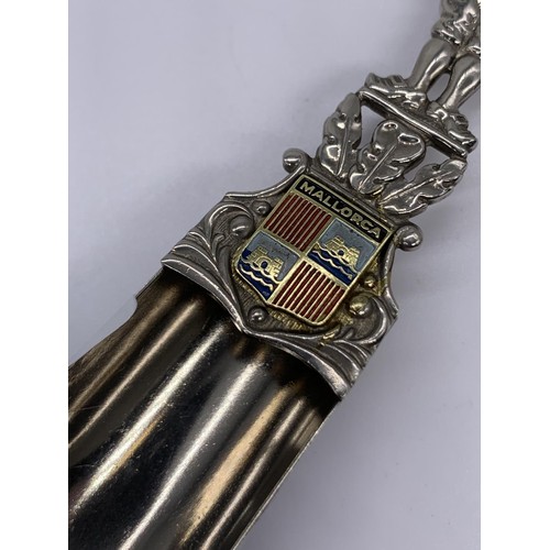 725 - A CONTINETAL  SILVER SHOVEL SPOON WITH ENAMEL & GOLD SHIELD