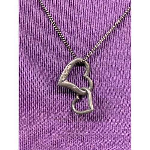 580 - SILVER DOUBLE HEART PENDANT ON A SILVER CHAIN