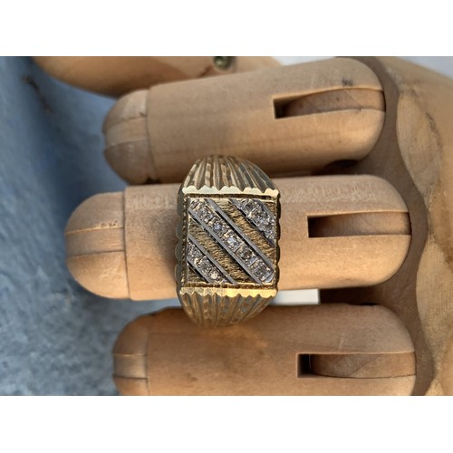 713 - A GENTS GOLD RING SQUARE HEAD SET WITH DIAMONDS ,DIAMOND CUT SHOULDERS APPROX N/O AND 6.8grms