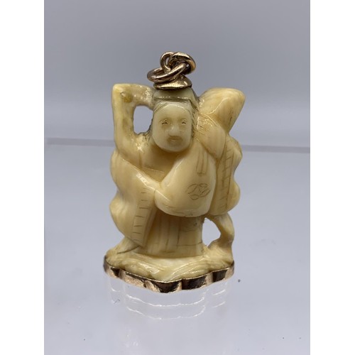 721 - ANTIQUE BONE CHARM WITH 18K GOLD MOUNTS