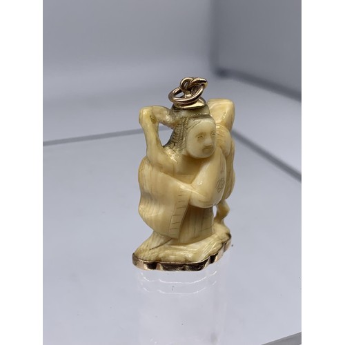 721 - ANTIQUE BONE CHARM WITH 18K GOLD MOUNTS