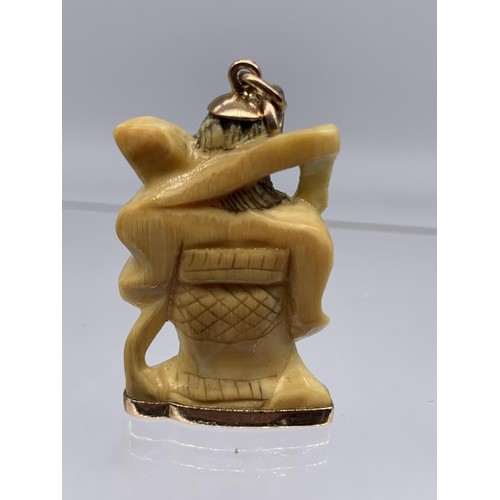 721 - ANTIQUE BONE CHARM WITH 18K GOLD MOUNTS