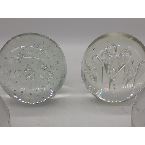 761 - 4 VERY LARGE AND HEAVY GLASS PAPERWEIGHTS