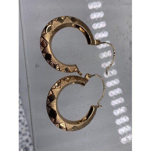 687 - A PAIR OF 9ct GOLD HOOP EARRINGS