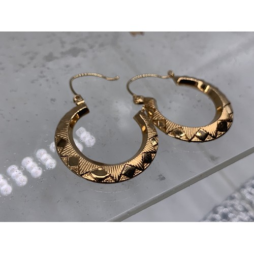 687 - A PAIR OF 9ct GOLD HOOP EARRINGS