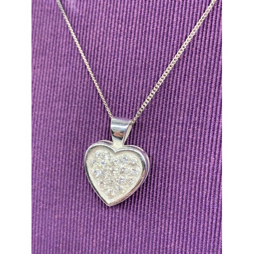 230A - A SILVER GEMSET HEART LOCKET ON A SILVER CHAIN