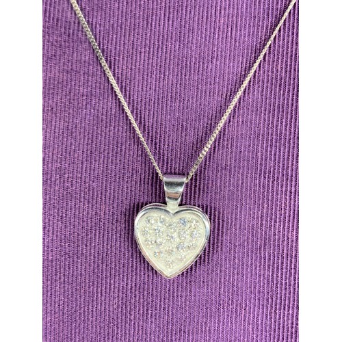 230A - A SILVER GEMSET HEART LOCKET ON A SILVER CHAIN