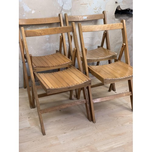 48 - 4 FOLDING OAK CHAIRS