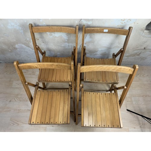 48 - 4 FOLDING OAK CHAIRS