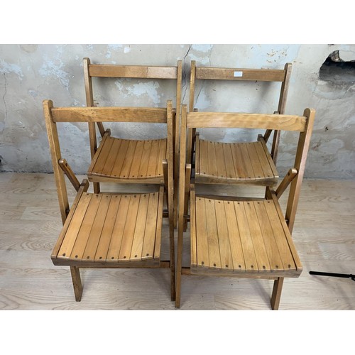 48 - 4 FOLDING OAK CHAIRS