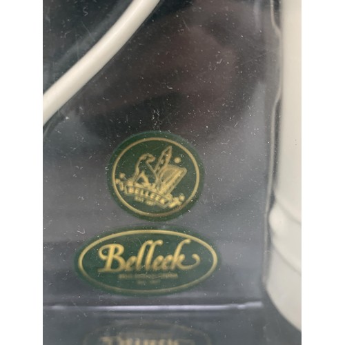 57 - A BOXED PAIR OF BELLEEK CLADDAGH  MUGS FOR LATTE