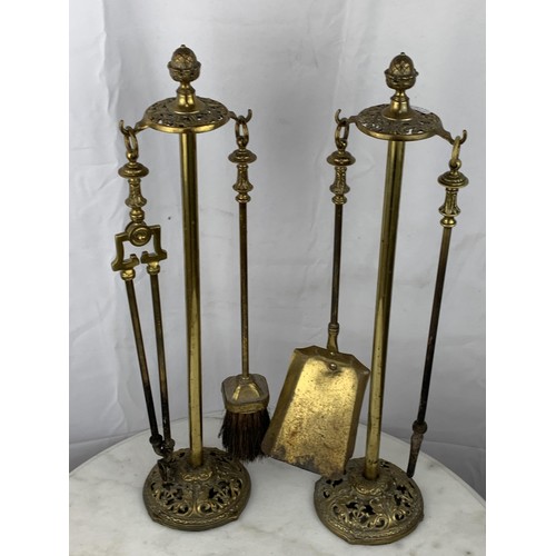 66 - AN OLD TWIN BRASS COMPANION SET **