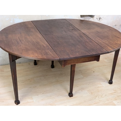 69 - A GEORGIAN MAHOGANY DROP LEAF TABLE **