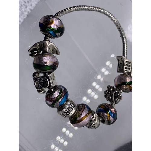 151 - A PANDORA BRACELET WITH CHARMS