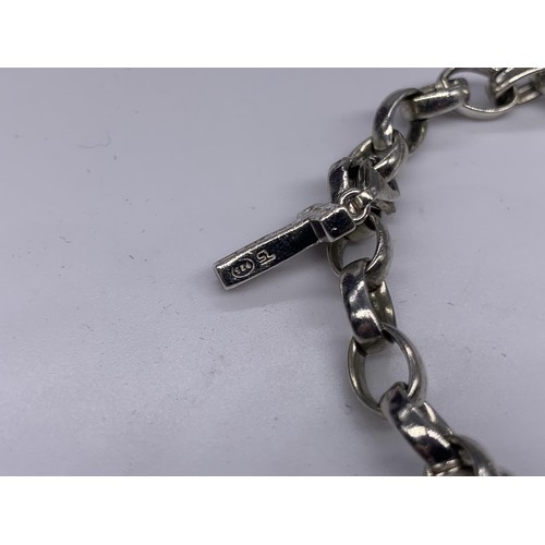 169 - A GENUINE TIFFANY SILVER BRACELET WITH 4 DETACHABLE CHARMS WITH CLASPS COMPRISING OF LOCK STAMPED T&... 