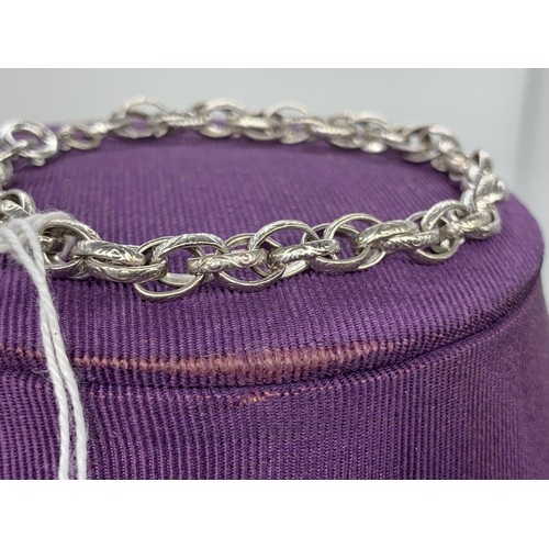 183 - A SILVER ENGRAVED DOUBLE LINK BRACELET 12.1 grms