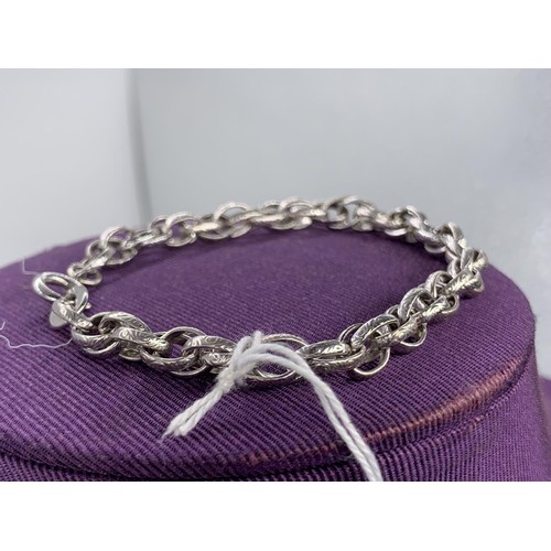 183 - A SILVER ENGRAVED DOUBLE LINK BRACELET 12.1 grms