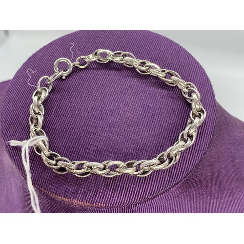 183 - A SILVER ENGRAVED DOUBLE LINK BRACELET 12.1 grms