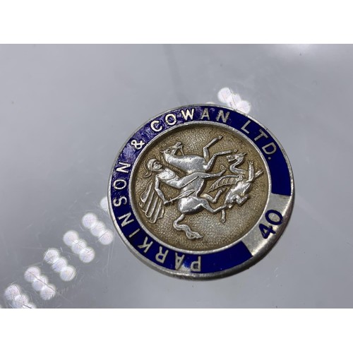 186 - A SILVER AND ENAMEL LAPEL BADGE DEPICTING St GEORGE AND THE DRAGON