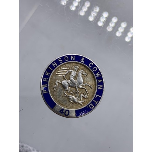 186 - A SILVER AND ENAMEL LAPEL BADGE DEPICTING St GEORGE AND THE DRAGON