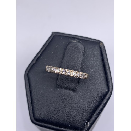 191 - FINE BAND ETERNITY RING SET WITH DIAMONDS IN 18CT YELLOW GOLD