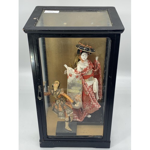 196 - ANTIQUE CASE CONTAINING ORIENTAL FIGURINES 14X8X7