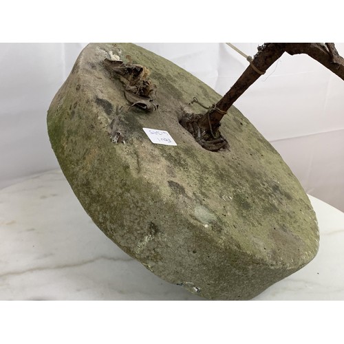 211 - A MILL STONE WITH METAL HANDLE