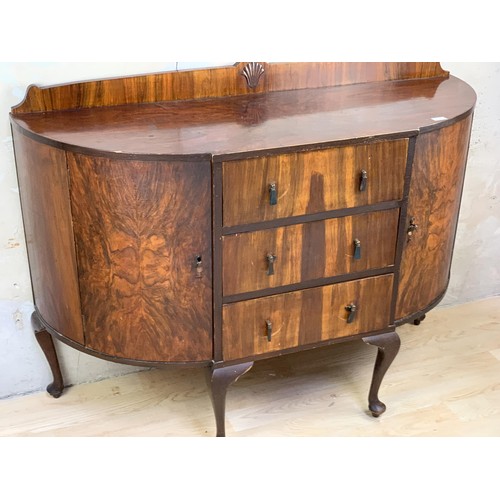 217 - A BOW FRONT WALNUT SIDEBOARD ON QUEEN ANNE LEG APPROX 55 x 19 x 40