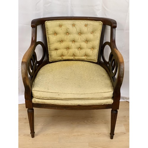 226 - A SHAPED ORNATE BUTTONED ARMCHAIR