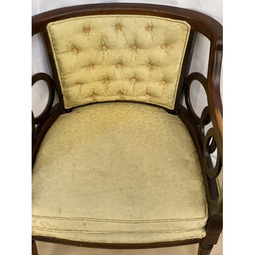 226 - A SHAPED ORNATE BUTTONED ARMCHAIR