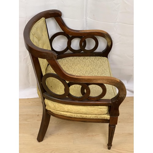 226 - A SHAPED ORNATE BUTTONED ARMCHAIR