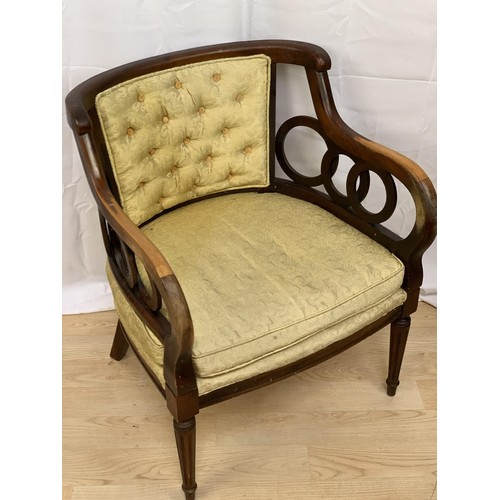 226 - A SHAPED ORNATE BUTTONED ARMCHAIR