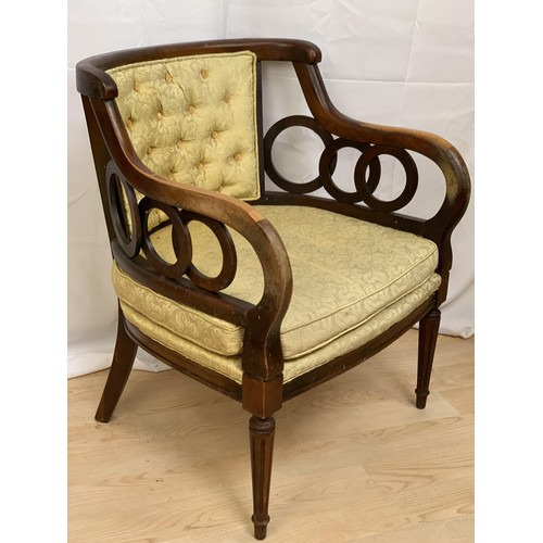 226 - A SHAPED ORNATE BUTTONED ARMCHAIR