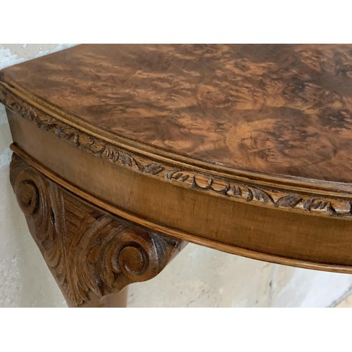 231 - A BURR WALNUT DEMI LUNE SIDE TABLE