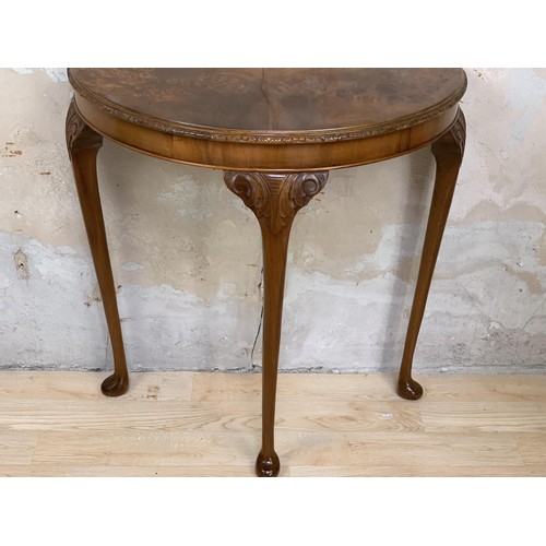 231 - A BURR WALNUT DEMI LUNE SIDE TABLE