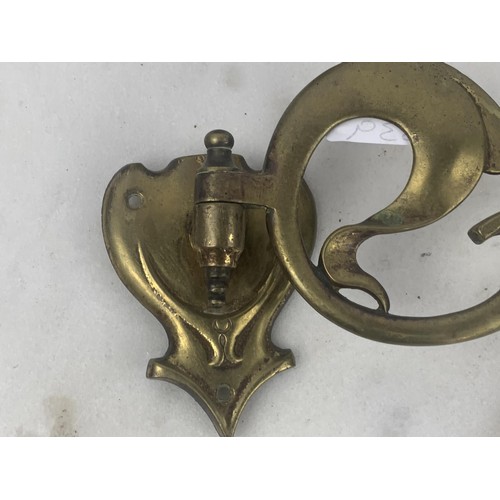 287 - AN ART DECO BRASS CANDLE SCONCE