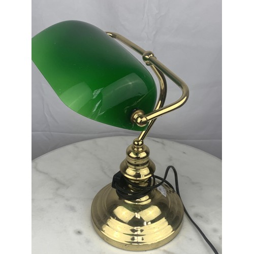 764 - A BRASS BASED BANKERS LAMPP WITH GREEN GLASS SHADE