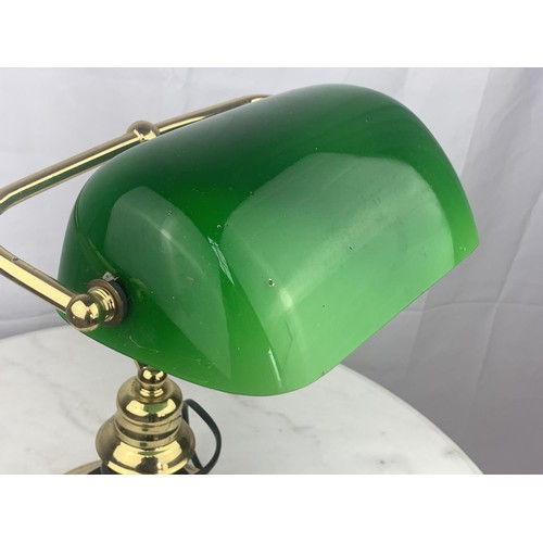 764 - A BRASS BASED BANKERS LAMPP WITH GREEN GLASS SHADE